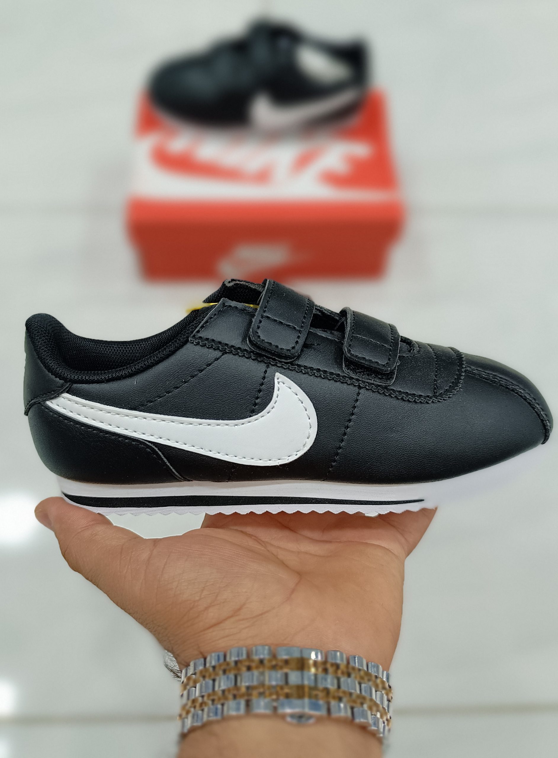 nike cortez black junior